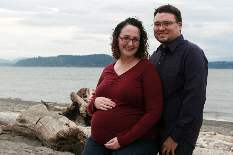 pregnant couple — family maternity photo shoot on the beach