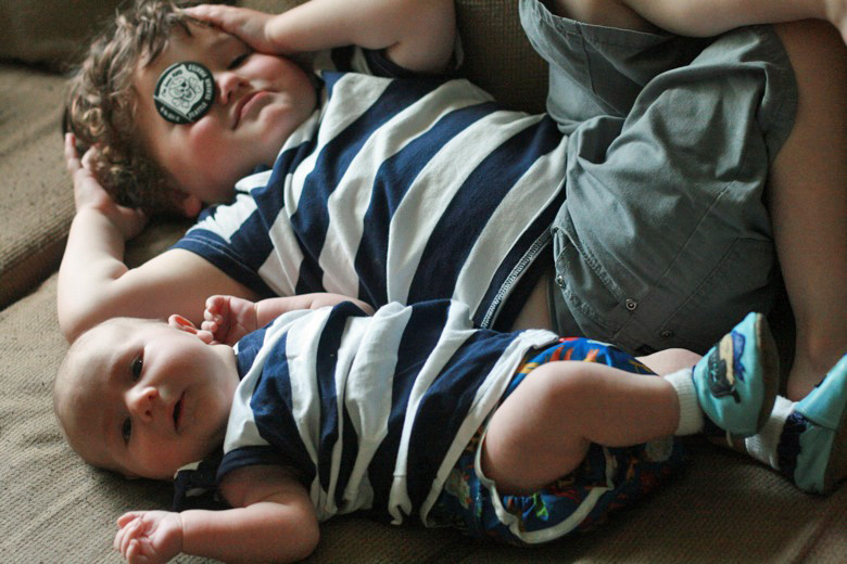 newborn baby Alrik 2mo a2mo with Mikko 4yo m4yo brothers lying next to each other