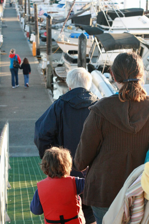 Liberty Bay boating outdoors — family walking down gangplank