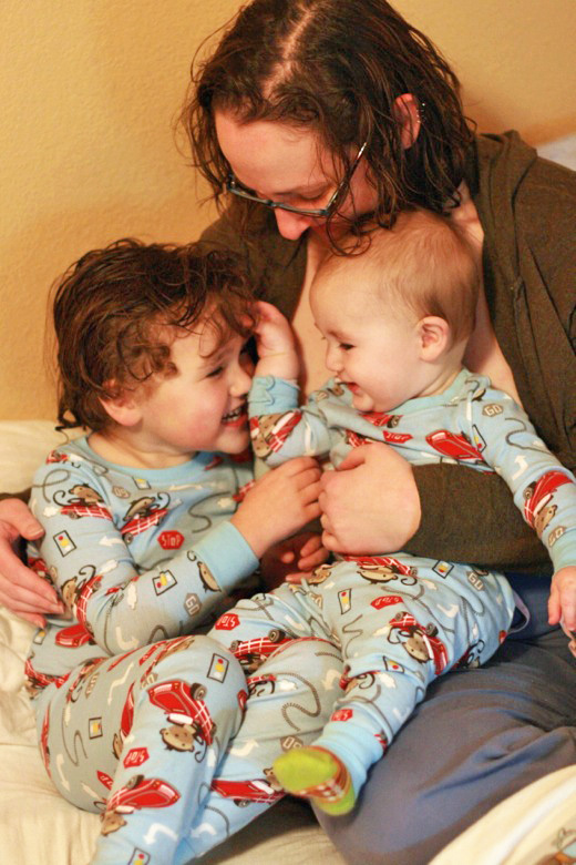 snuggly jammy boys and mom in matching monkey jammies