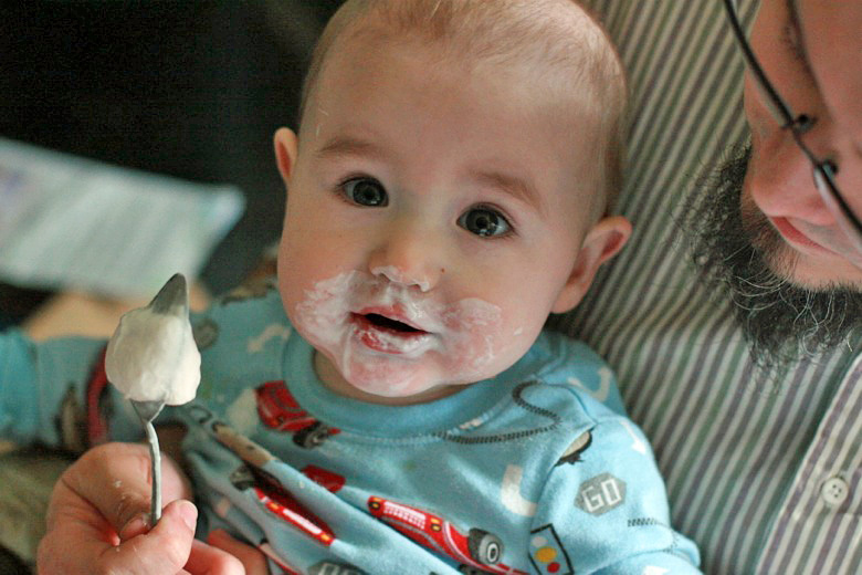 eating frozen yogurt on a spoon — baby led solids