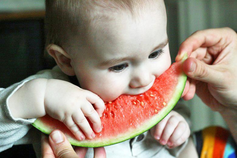 baby boy eating watermelon