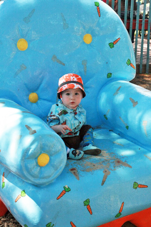 baby in amusement park on big blue chair &#8212;&nbsp;Six Flags California