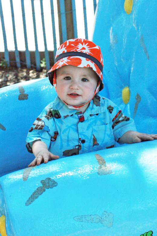 baby in amusement park on big blue chair &#8212;&nbsp;Six Flags California