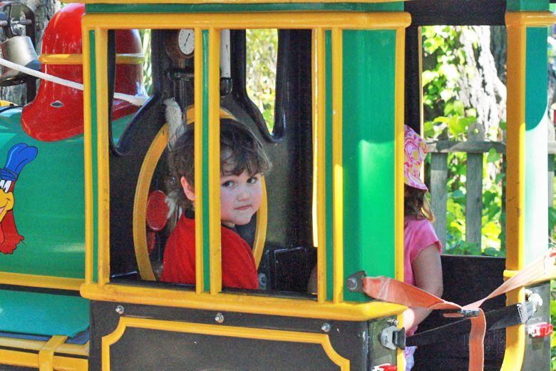 boy on amusement park train ride &#8212;&nbsp;Six Flags California