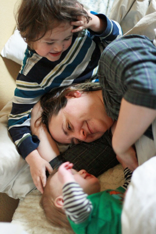 cosleeping mama and boys waking up in bed