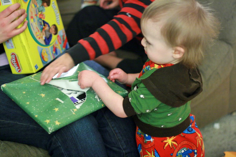 opening Christmas Eve presents of book &mdash;