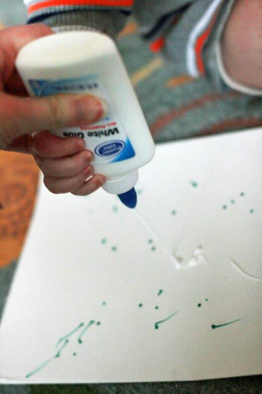 toddler gluing on paper - crafts art