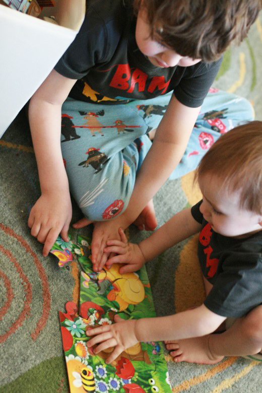 brothers putting together gift puzzle - Easter 2013 holidays