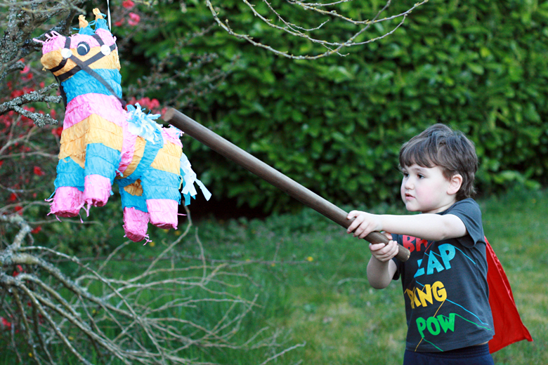 boy hitting pinata - Easter 2013 holidays