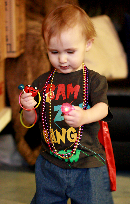 toddler wearing pinata prizes - Easter 2013 holidays