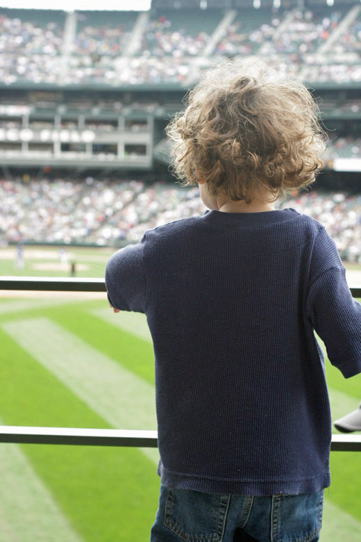 boy watches baseball ballfield at Safeco Field