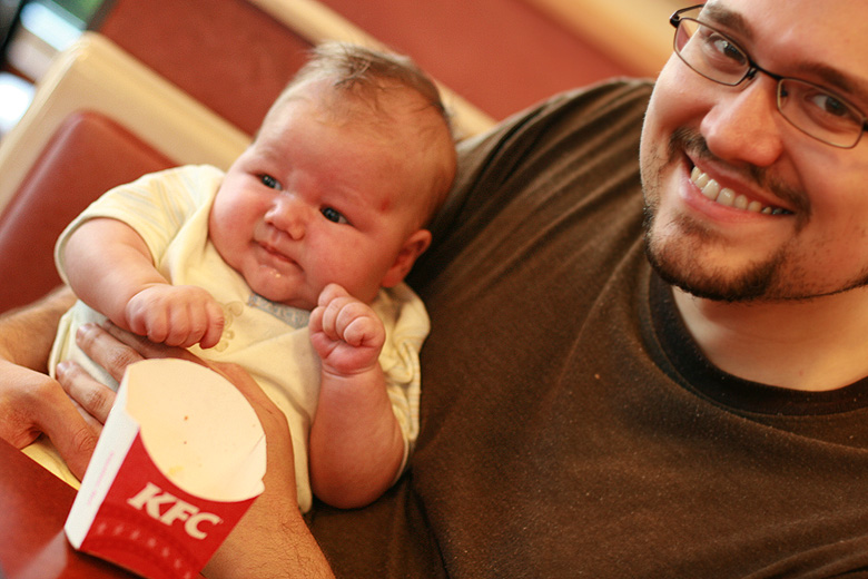 newborn baby and dad at fast food restaurant