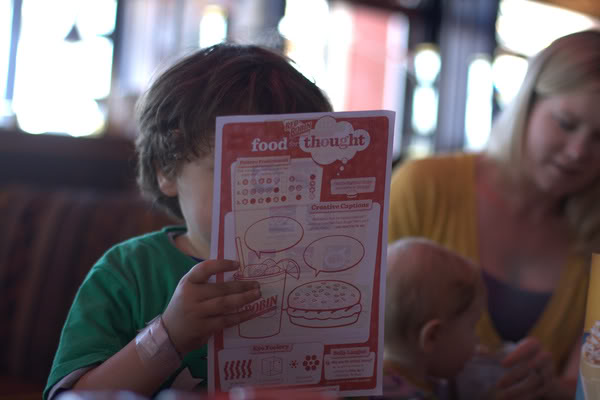 boy reading kids menu at Red Robin in downtown Seattle &#8212;&nbsp;mikko m5yo