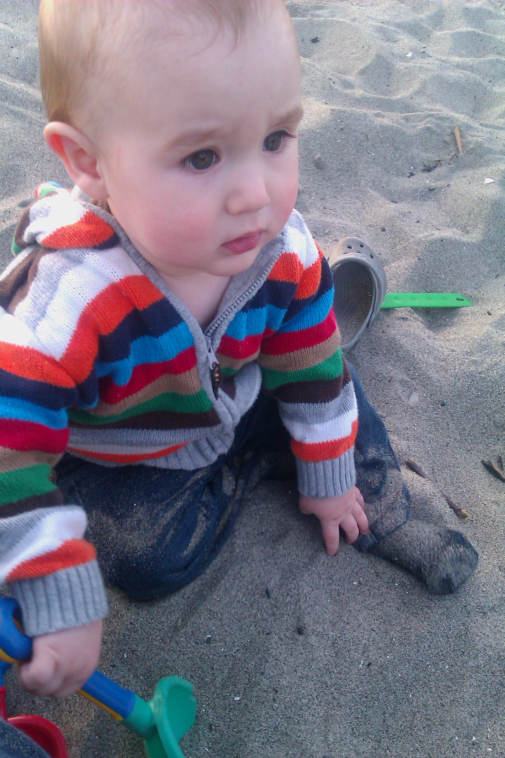 baby crawling on the beach