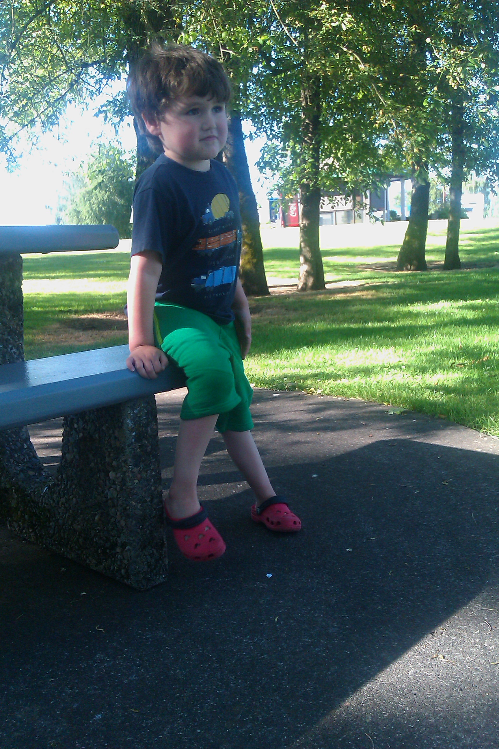 boy on bench at rest stop