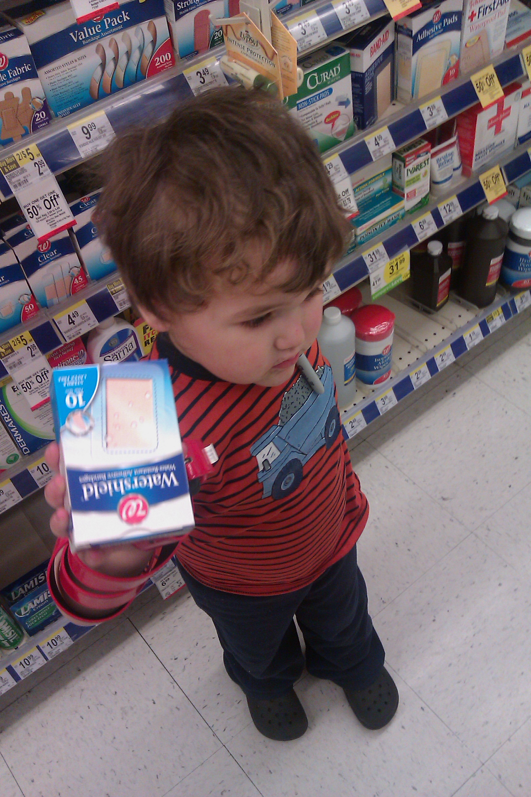 boy at Walgreens with Watershield large bandages