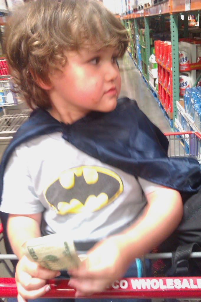 batman boy in shopping cart at costco