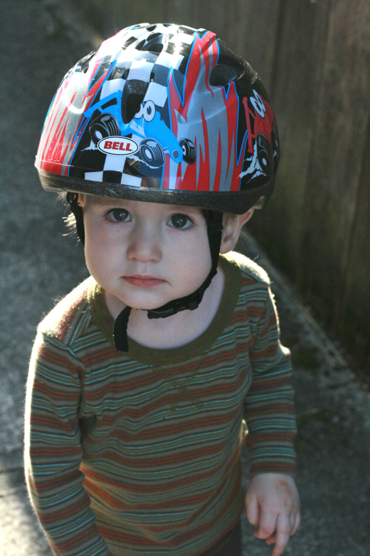 toddler boy in bike helmet - biking outdoors