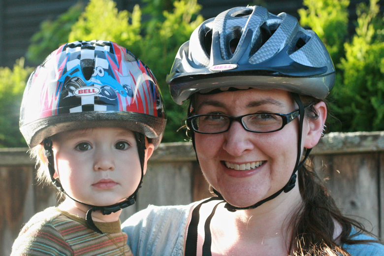mom and toddler boy in bike helmet - biking outdoors
