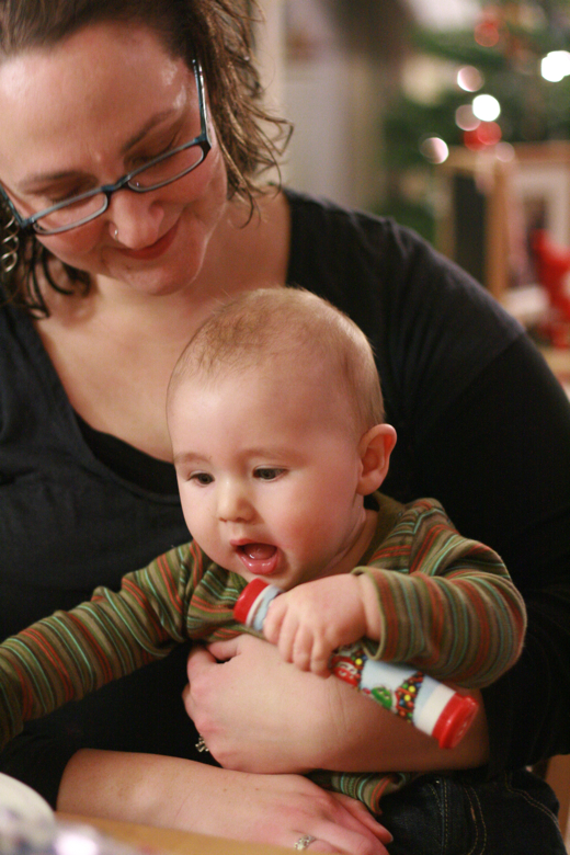 mom and baby at cookie decorating party — Christmas 2011
