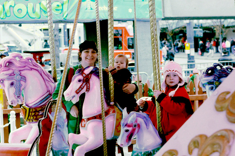 family on carousel — Christmas downtown Seattle meetup holidays