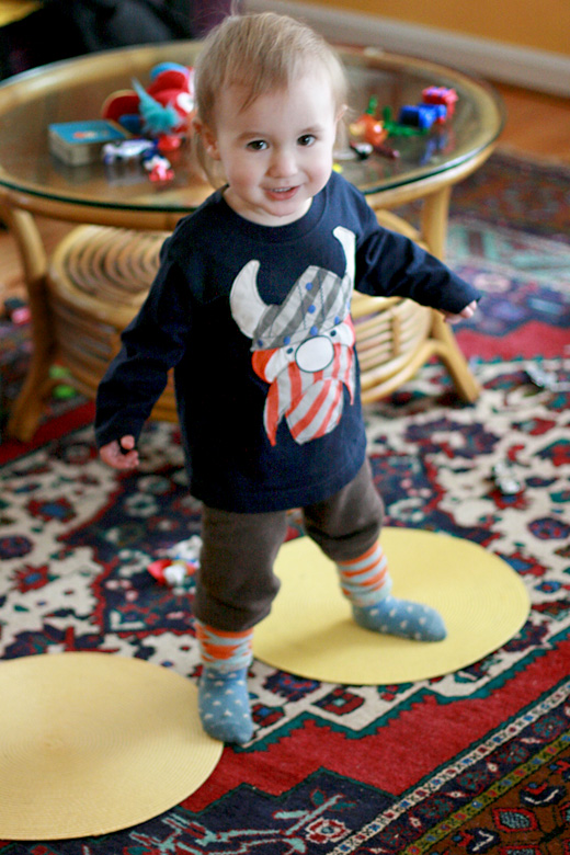 toddler boy in viking shirt on dot placemats - portland trip travel