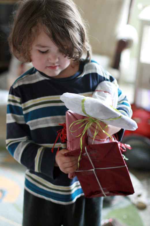 blase boy holding gifts - valentine's day 2013