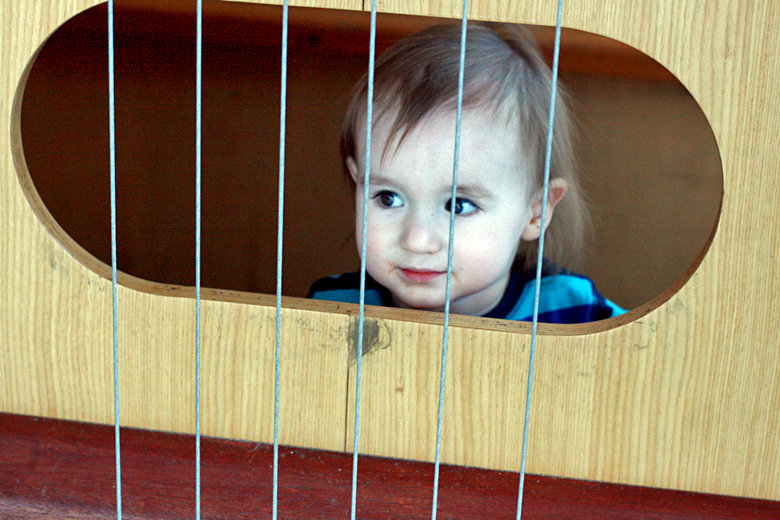 baby in giant guitar - pacific science center outing seattle unschooling