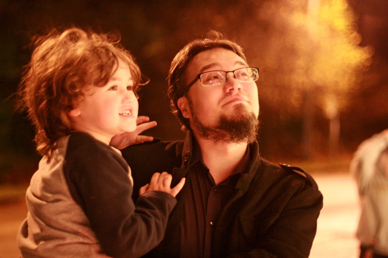 dad and boy viewing Christmas lights
