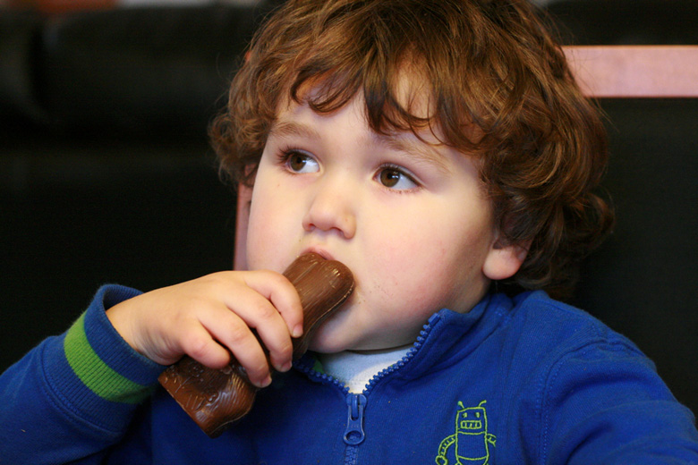 three-year-old eating chocolate bunny