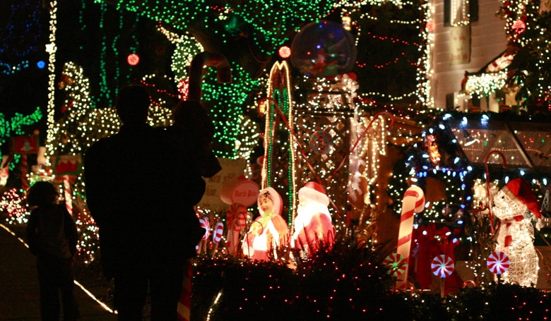 family silhouettes — Menashe Christmas lights West Seattle