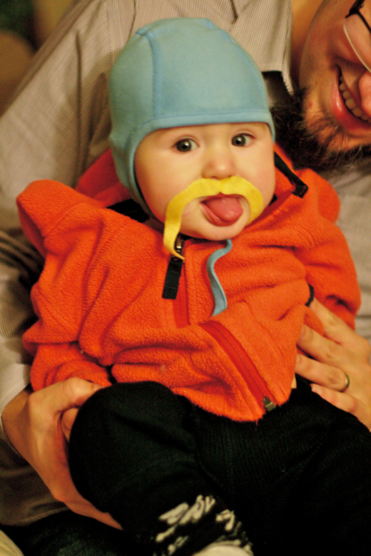 baby in mustache sticking out tongue