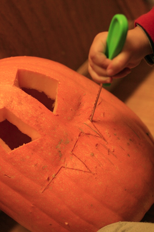 carving the pumpkin smile